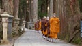 Monks walking on the 2 km long path with ancient tombs in the Okunoin cemetery