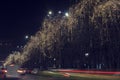 13 DEC 2018, Romania, Bucharest. Christmas garland, blurred cars lights and traffic at Bulevardul Unirii. Long exposure image
