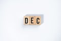 ` DEC ` text made of wooden cube on White background