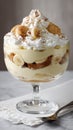 Decadent banana pudding trifle with whipped cream and sponge cake layers Royalty Free Stock Photo