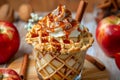 Decadent Caramel Apple Sundae with Whipped Cream, Nuts, and a Cinnamon Stick in Waffle Cone Bowl on Wooden Background