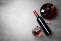 Decanter, glass and bottle with red wine on color background, flat lay. Royalty Free Stock Photo