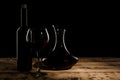 Decanter, glass and bottle with red wine on table Royalty Free Stock Photo