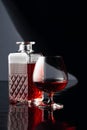Decanter and glass of brandy on a black background Royalty Free Stock Photo