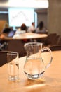 Decanter and glass with clean clear water on table Royalty Free Stock Photo