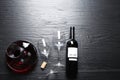 Decanter, glasses and bottle with red wine on wooden background, flat lay.