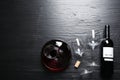 Decanter, glasses and bottle with red wine on wooden background, flat lay