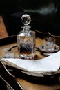 Decanter and glasses on occasional table Royalty Free Stock Photo