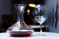 Decanter with red wine and glass on a table Royalty Free Stock Photo