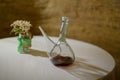Decanter with red wine on a table . Wine drinking vessel typical of Spain Porron Royalty Free Stock Photo