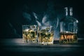 Decanter and two glasses of whiskey on marble background Royalty Free Stock Photo