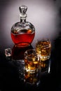 Decanter and two glasses with whisky and ice Royalty Free Stock Photo