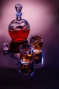 Decanter and two glasses with whisky and ice Royalty Free Stock Photo