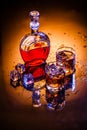 Decanter and two glasses with whisky and ice Royalty Free Stock Photo