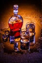 Decanter and two glasses with whisky and ice Royalty Free Stock Photo