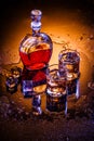 Decanter and two glasses with whisky and ice Royalty Free Stock Photo