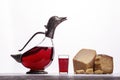 Decanter with wine in the form of ducks, glass with wine, Parma ham and expensive blue cheese. Royalty Free Stock Photo