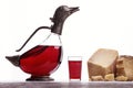 Decanter with wine in the form of ducks, glass with wine, Parma ham and expensive blue cheese. Royalty Free Stock Photo