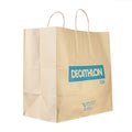 Decathlon brand paper bag. Decathlon is a french company and one of the world`s largest sporting goods retailers. File contains Royalty Free Stock Photo