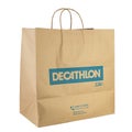 Decathlon brand paper bag. Decathlon is a french company and one of the world`s largest sporting goods retailers. File contains Royalty Free Stock Photo