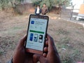decathlon online shopping app displayed on smart phone screen at agriculture field in india dec 2019