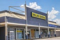 Dollar General store entrance and sign with boarded up windows Royalty Free Stock Photo