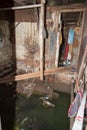 Decayed and flooded slum house