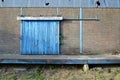 Decayed industrial door of a warehouse Royalty Free Stock Photo