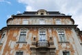 Decaying classicistic town house with typical balcony and windows, located in Esztergom, Hungary.