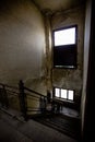 Decaying Stairway: Inside View of Abandoned Industrial Building\'s Staircase
