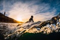 December 28, 2019. Anapa, Russia. Surfer in wetsuit on longboard with sea wave. Winter surfing in Russia