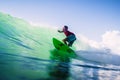 December 30, 2020. Bali, Indonesia. Surfer ride on surfboard at ocean wave. Professional surfing at perfect waves