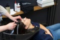 December 10, 2022 Balti Moldova. The process of washing hair in a beauty salon. Illustrative editorial