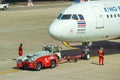 2018 December 14. Bangkok Thailand. airport ground worker moving an Air Asia airline plane to prepare for take off.