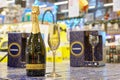 December 2, 2021 Beltsy Moldova. A glass of champagne and a bottle of sparkling wine on a supermarket shelf