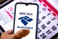 December 19, 2020, Brazil. In this photo illustration the Receita Federal IRPF 2021 logo seen displayed on a smartphone