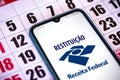 December 19, 2020, Brazil. In this photo illustration the Receita Federal RestituiÃÂ§ÃÂ£o logo seen displayed on a smartphone