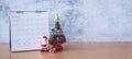 December calendar and Christmas decoration - Santa Clause, tree and gift on wooden table. Christmas and Happy new year concept Royalty Free Stock Photo