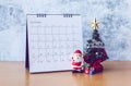 December calendar and Christmas decoration - Santa Clause, tree and gift on wooden table. Christmas and Happy new year concept Royalty Free Stock Photo