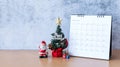 December calendar and Christmas decoration - Santa Clause, tree and gift on wooden table. Christmas and Happy new year concept Royalty Free Stock Photo