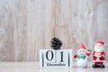 1 December calendar with Christmas decoration, snowman, Santa claus and pine tree  on wooden table background, preparation for Royalty Free Stock Photo