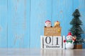 1 December calendar with Christmas decoration, snowman, Santa claus and pine tree  on wooden table background, preparation for Royalty Free Stock Photo