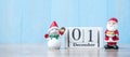 1 December calendar with Christmas decoration, snowman, Santa claus and pine tree  on wooden table background, preparation for Royalty Free Stock Photo