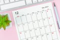 December 2021 calendar sheet with keyboard computer Royalty Free Stock Photo