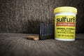 1 December 2019 - Calgary , Alberta Canada - A jar of Sulfur 8 medicated hair cream with a comb