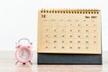 December 2021 Desk calendar with pink alarm clock Royalty Free Stock Photo