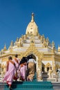 15 December 2016 Female myanmar and nun walking at Swe Taw Myat, Buddha Tooth Relic Pagoda a famous and beautiful buddhist temple