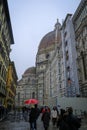 December 2021 Florence, Italy: Dome of Santa Maria del Fiore, Battistero di San Giovanni, Piazza san giovanni on a rainy day. Tou