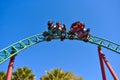 Friends enjoy snaking ride on Cobra`s Curse rollercoaster at Bush Gardens Tampa Bay Theme Park