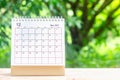 December month, Calendar desk 2021 for organizer to planning and reminder on wooden table with green nature background Royalty Free Stock Photo